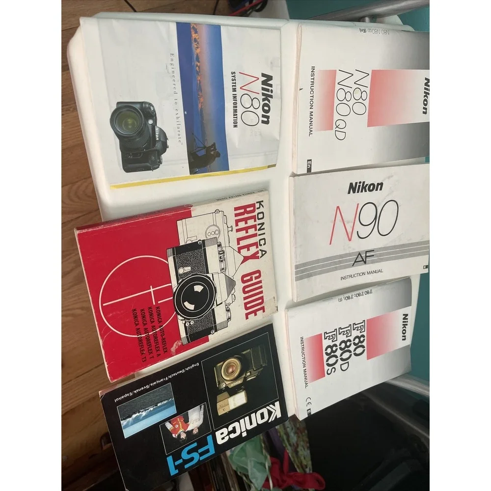 Lot of 6 vintage nikon , konica camera's manuals (8?)